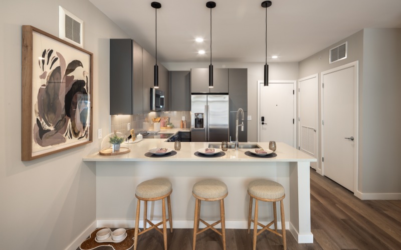 a kitchen with bar stools