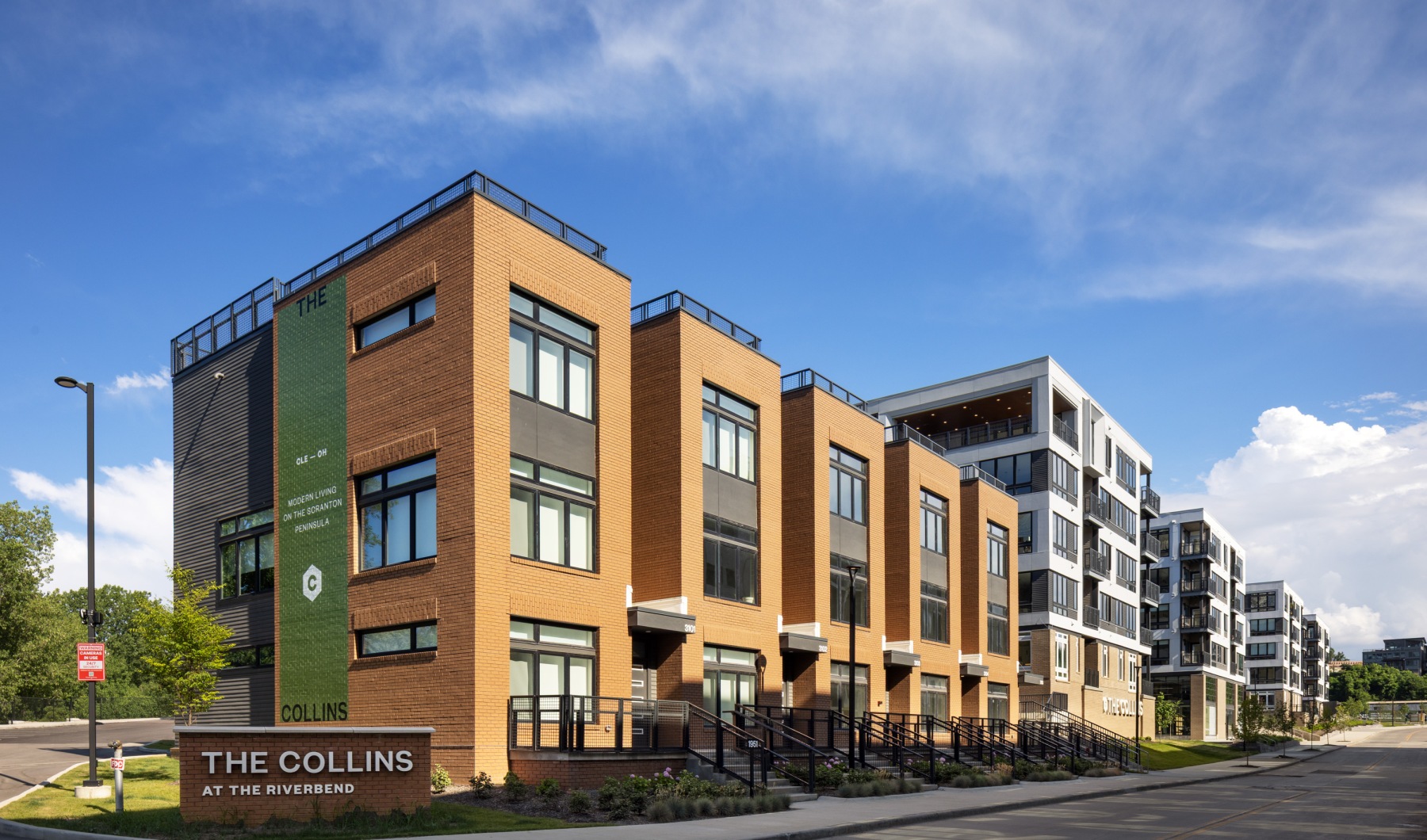townhomes and apartments with a street in front