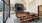 a room with a coffee bar and large windows