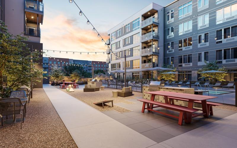 a courtyard with benches and tables